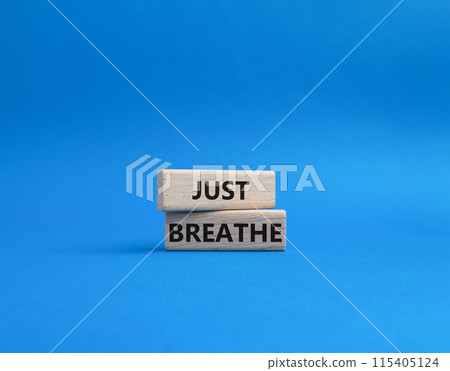 Just Breathe symbol. Wooden blocks with words Just Breathe. Beautiful blue background. Business and Just Breathe concept. Copy space. 115405124