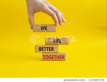 We are better together symbol. Wooden blocks with words We are better together. Beautiful yellow background. Businessman hand. We are better together concept. Copy space. We are better together symbol. Wooden blocks with words We are better together. Beautiful yellow background. Businessman hand. We are better together concept. Copy space. 115405158