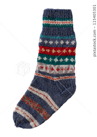 Knitting socks from woolen threads. Handmade cozy homemade warm winter colorful striped knitted socks. 115405301