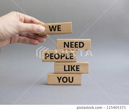 Hiring symbol. Wooden blocks with words We need People like You. Businessman hand. Beautiful grey background. Business and Hiring concept. Copy space. 115405371