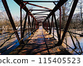 Old rusty bridge made of metal trusses 115405523