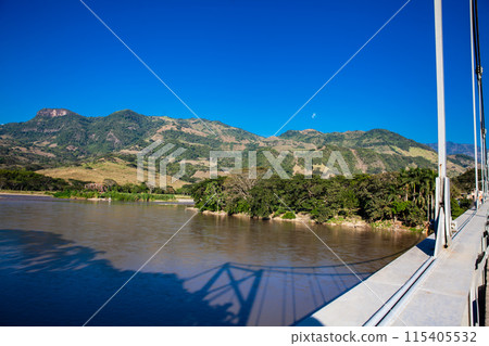 View of the Cauca River from the Cauca Bridge located at La Pintada in the Municipality of Aguadas at the department of Caldas in Colombia 115405532