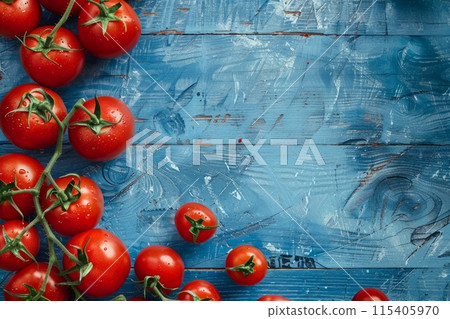 Bright red tomatoes on a branch, on a blue wooden background with scratches Bright red tomatoes on a branch, on a blue wooden background with scratches 115405970