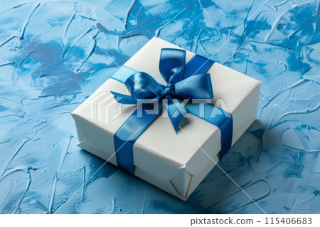 White gift box with a bow, on a blue background 115406683