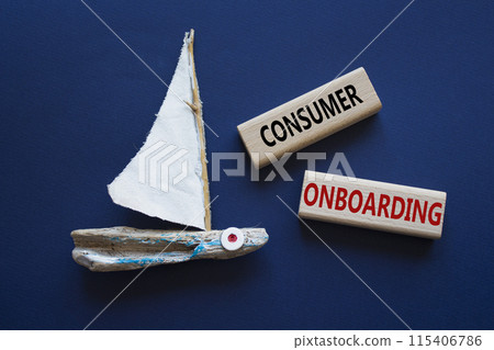 Consumer Onboarding symbol. Wooden blocks with words Consumer Onboarding. Beautiful deep blue background with boat. Business and Consumer Onboarding concept. Copy space. 115406786