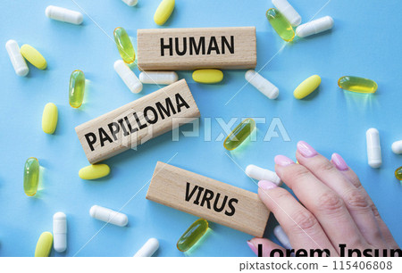 Human Papilloma Virus symbol. Concept word Human Papilloma Virus on wooden blocks. Doctor hand. Beautiful blue background with pills. Medicine and Human Papilloma Virus concept. Copy space Human Papilloma Virus symbol. Concept word Human Papilloma Virus on wooden blocks. Doctor hand. Beautiful blue background with pills. Medicine and Human Papilloma Virus concept. Copy space 115406808