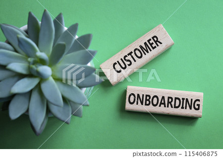 Customer Onboarding symbol. Concept word Customer Onboarding on wooden blocks. Beautiful green background with succulent plant. Business and Customer Onboarding concept. Copy space Customer Onboarding symbol. Concept word Customer Onboarding on wooden blocks. Beautiful green background with succulent plant. Business and Customer Onboarding concept. Copy space 115406875