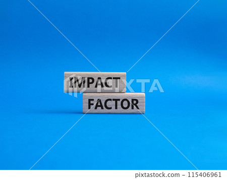 Impact Factor symbol. Wooden blocks with words Impact Factor. Beautiful blue background. Business and Impact Factor concept. Copy space. 115406961