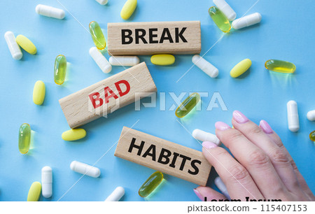 Break bad habits symbol. Concept words Break bad habits on wooden blocks. Beautiful blue background with pills. Doctor hand. Medicine and Break bad habits concept. Copy space. Break bad habits symbol. Concept words Break bad habits on wooden blocks. Beautiful blue background with pills. Doctor hand. Medicine and Break bad habits concept. Copy space. 115407153