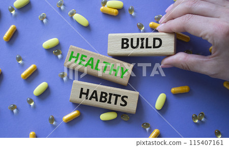 Healthy habits symbol. Concept word Build Healthy habits on wooden blocks. Doctor health. Beautiful purple background with pills. Healthy lifestyle and Healthy habits concept. Copy space 115407161
