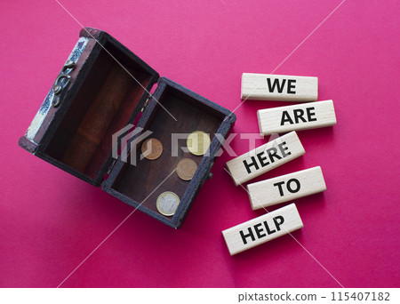 We are here to help symbol. Concept words we are here to help on wooden blocks. Beautiful red background with box with coins. Business and we are here to help concept. Copy space. 115407182