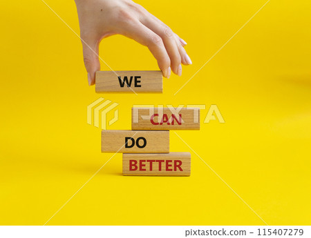 We Can Do Better symbol. Concept words We Can Do Better on wooden blocks. Beautiful yellow background. Businessman hand. Business and We Can Do Better concept. Copy space. We Can Do Better symbol. Concept words We Can Do Better on wooden blocks. Beautiful yellow background. Businessman hand. Business and We Can Do Better concept. Copy space. 115407279