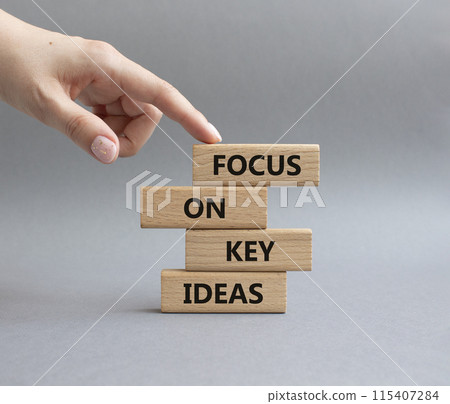 Focus on Key Ideas symbol. Concept words Focus on Key Ideas on wooden blocks. Beautiful grey background. Businessman hand. Business and Focus on Key Ideas concept. Copy space Focus on Key Ideas symbol. Concept words Focus on Key Ideas on wooden blocks. Beautiful grey background. Businessman hand. Business and Focus on Key Ideas concept. Copy space 115407284