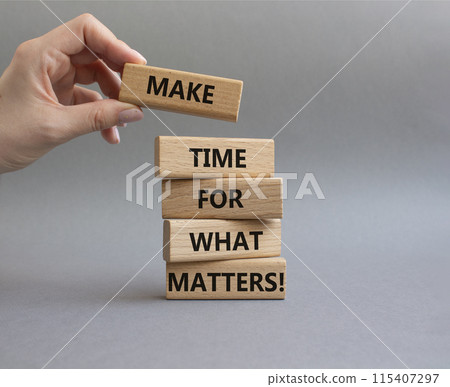 Important thing symbol. Wooden blocks with words Make time for what matters. Businessman hand. Beautiful grey background. Business and important thing concept. Copy space. Important thing symbol. Wooden blocks with words Make time for what matters. Businessman hand. Beautiful grey background. Business and important thing concept. Copy space. 115407297