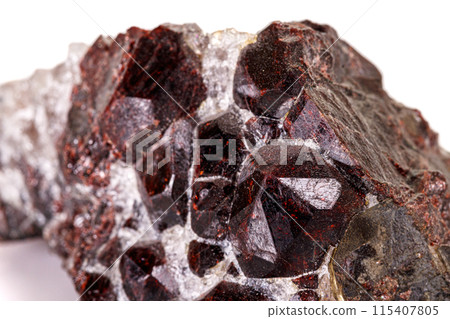 Macro stone garnet mineral on white background 115407805