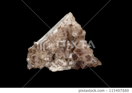Macro mineral stone smoky quartz, rauchtopaz on a black background 115407880