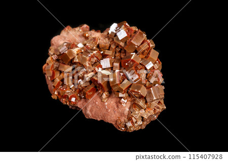 Macro mineral stone Vanadinite on a black background 115407928