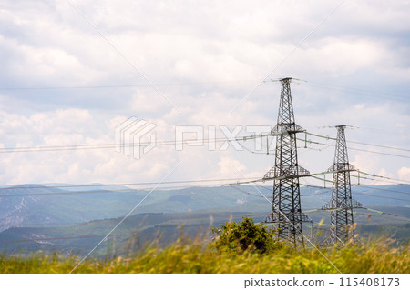 High voltage towers Electric pole. Power line support with wires for electricity transmission. High voltage grid tower with wire cable at distribution station. Energy industry, energy saving High voltage towers Electric pole. Power line support with wires for electricity transmission. High voltage grid tower with wire cable at distribution station. Energy industry, energy saving 115408173