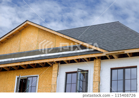 As part construction of house, joist framework with plywood is installed, gutter holders soffit fascia trim are installed As part construction of house, joist framework with plywood is installed, gutter holders soffit fascia trim are installed 115408726