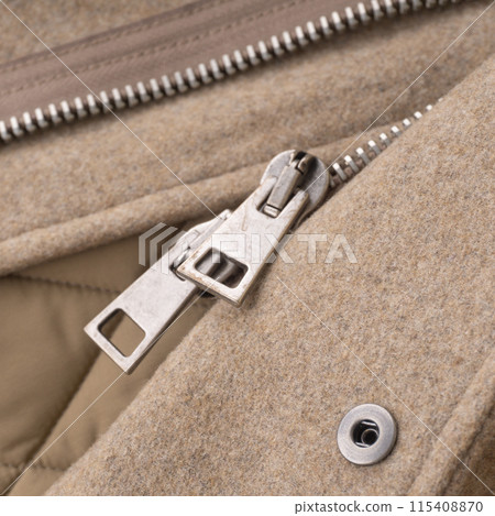 Double metal zipper of a light beige wool coat Double metal zipper of a light beige wool coat 115408870