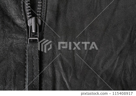 Crumpled black suede textured horizontal background with black metal zip 115408917