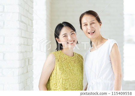 Portrait of a senior woman and her daughter Portrait of a senior woman and her daughter 115409558
