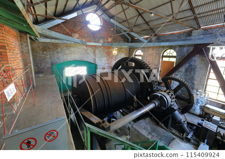 [Kumamoto Prefecture] The winding machine room of the second shaft tower of the Manda Pit of the Mitsui Miike Coal Mine on a clear day (Meiji Industrial Revolution Heritage Sites of Japan) 115409924