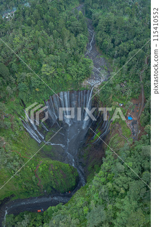 .Aerial view Thousands of waterfalls flow together at Tumpak Sewu Waterfall .Aerial view Thousands of waterfalls flow together at Tumpak Sewu Waterfall 115410552