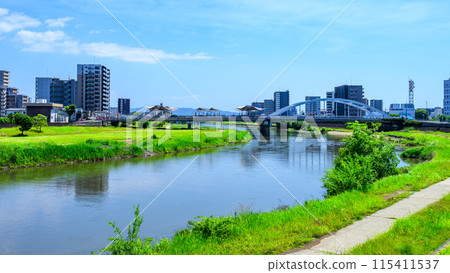 Scenery around Kumamoto Station on a beautiful, clear blue sky (East Exit Station, Transportation) [Scenery around the Shirakawa River] 115411537