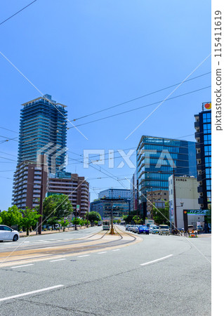 Scenery around Kumamoto Station on a beautiful, clear blue sky (East Exit Station, Transportation) [East Exit, Streetcar, Photo taken from the Gionbashi area] 115411619