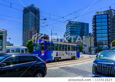 Scenery around Kumamoto Station on a beautiful, clear blue sky (East Exit Station, Transportation) [East Exit, Streetcar, Photo taken from the Gionbashi area] 115411623