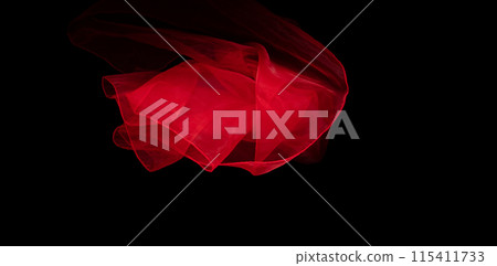 Red organza fabric flying in curve shape, Piece of textile Red organza fabric throw fall in air. Black background isolated, dark shading environment 115411733
