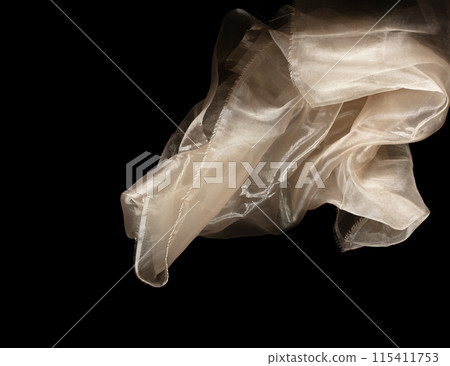 Yellow gold organza fabric flying in curve shape, Piece of textile Yellow gold organza fabric throw fall in air. Black background isolated, dark shading environment Yellow gold organza fabric flying in curve shape, Piece of textile Yellow gold organza fabric throw fall in air. Black background isolated, dark shading environment 115411753