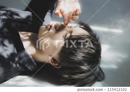 Man wearing colored contact lenses Man wearing colored contact lenses 115412102