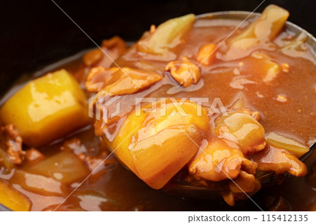 Close-up of homemade curry in a pot 115412135