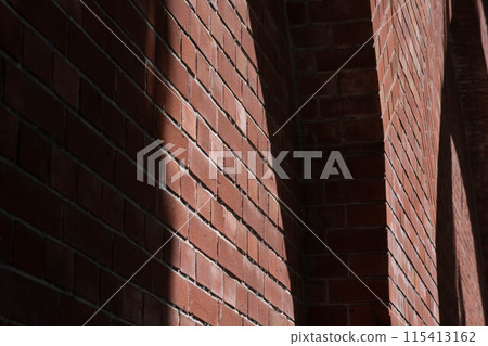 Shadowy red brick wall Shadowy red brick wall 115413162