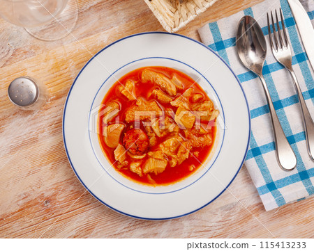 Soup from tasty boiled beef tripe with chorizo at plate Soup from tasty boiled beef tripe with chorizo at plate 115413233