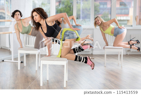Group of women doing high heels dance class Group of women doing high heels dance class 115413559