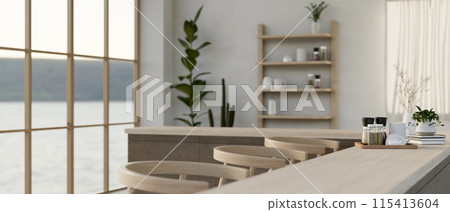 A close-up image of a wooden counter bar with stools in a modern minimalist restaurant or cafe. 115413604