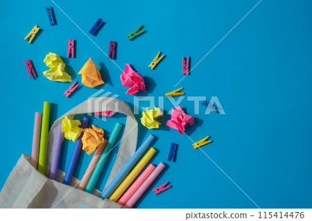 Empty space of school stationery supplies. Copy space for your text or Educational greeting announcement for students and teacher. Top view flat lay Creative vivid colorful background Empty space of school stationery supplies. Copy space for your text or Educational greeting announcement for students and teacher. Top view flat lay Creative vivid colorful background 115414476