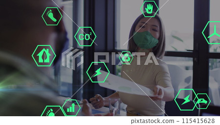 Image of ecology icons over asian businesswoman with face mask holding document Image of ecology icons over asian businesswoman with face mask holding document 115415628