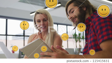 Image of media icons over caucasian business people using tablet Image of media icons over caucasian business people using tablet 115415631
