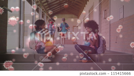 Image of covid 19 cells with children in masks social distancing eating at school 115415666