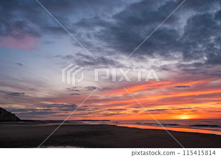 Experience a breathtaking coastal sunset with vibrant skies and the soothing sound of ocean waves Experience a breathtaking coastal sunset with vibrant skies and the soothing sound of ocean waves 115415814