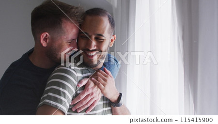 Diverse gay couple shares a tender moment, with Diverse gay couple shares a tender moment, with 115415900