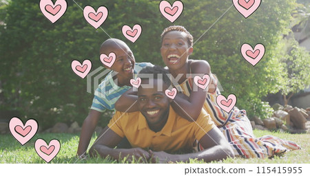 Image of hearts over happy african american family in garden Image of hearts over happy african american family in garden 115415955