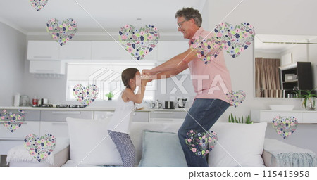 Image of happy caucasian grandfather and granddaughter jumping on sofa 115415958