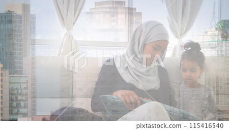 Image of asian mother in hijab at home with daughter over cityscape 115416540