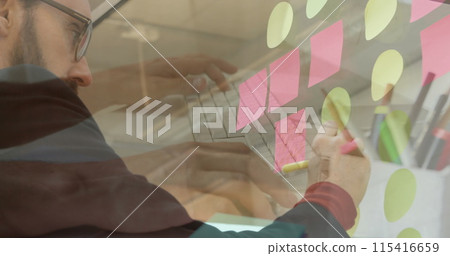 Image of hands using laptop over brainstorming businessman writing notes 115416659