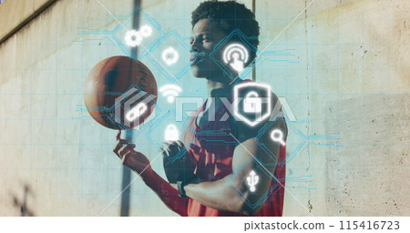 Image of media icons over african american man with basketball 115416723